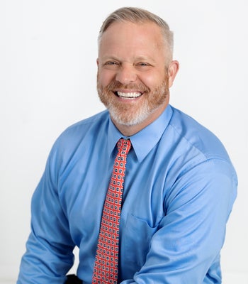 Portrait of Adam Crews, Realtor®.